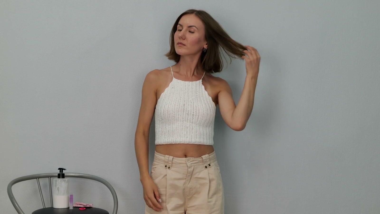Adult participant moving her hair during a controlled grooming task