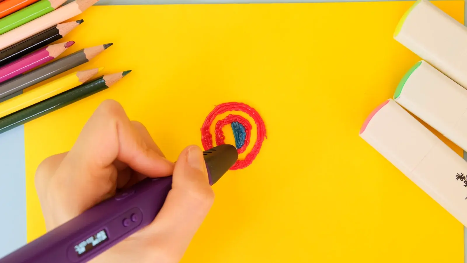 Hand using a 3D pen from the Creative Hands sample